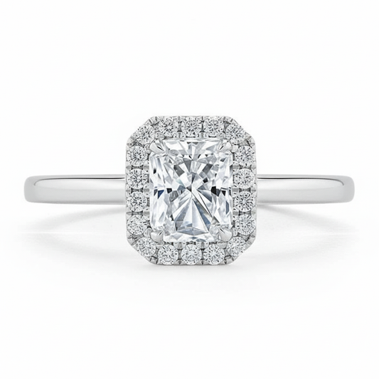 moissanite ring with a cushion-cut center stone and diamond halo on a white background